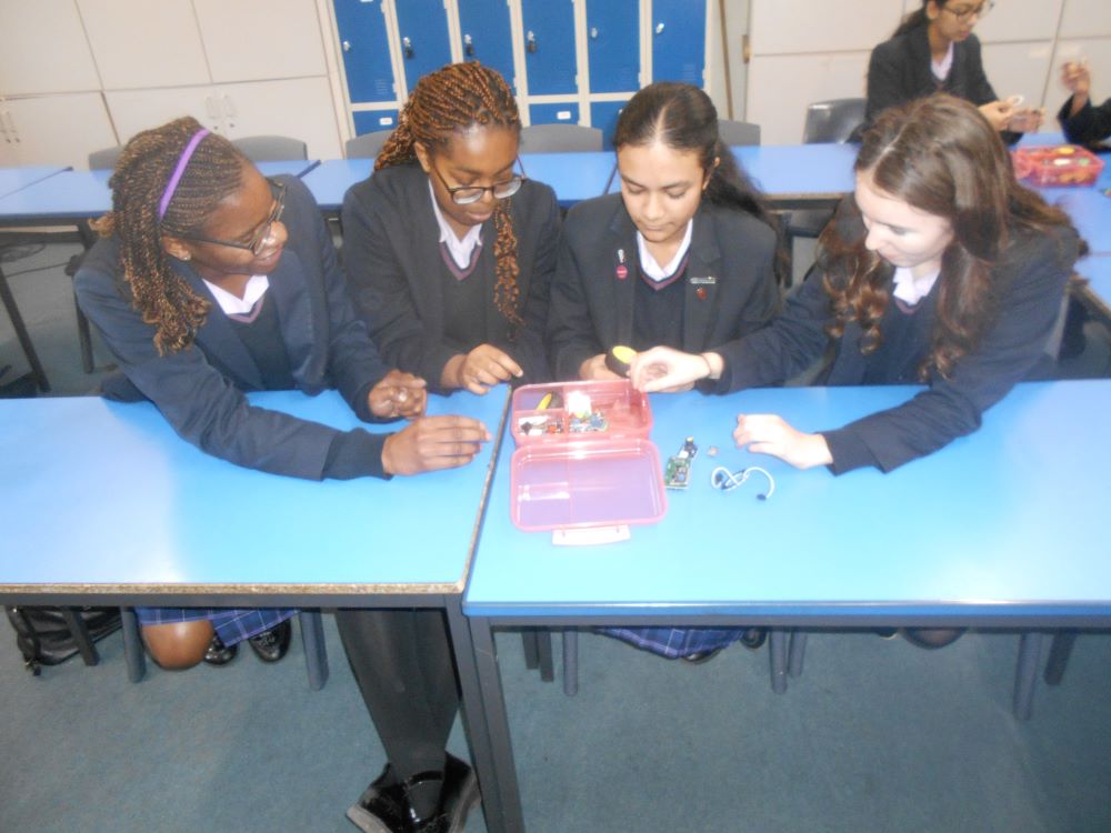 Some students exploring the kit contents