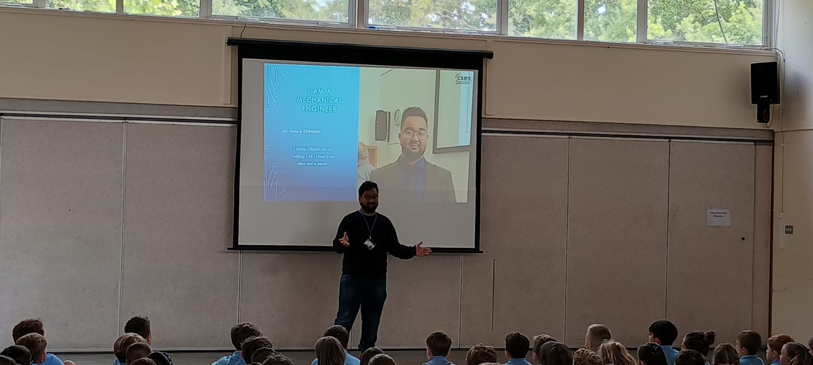 Joanne giving a talk to primary school pupils in their assembly hall