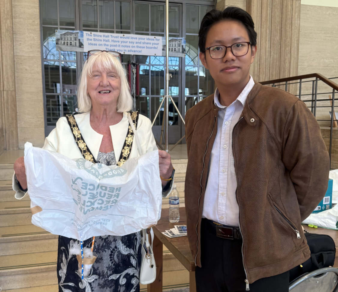 The Mayor holding a parachute with CSES Secretary Jayce in the Shire Hall